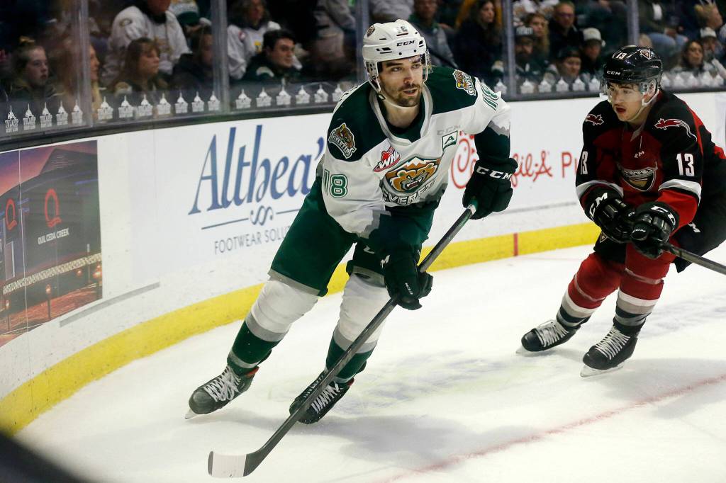 The Everett Silvertips&rsquo; Hunter Campbell brings the puck out from behind the net against the Vancouver Giants during the first round of the WHL playoffs Friday, April 22, 2022, at Angel of the Winds Arena in Everett, Washington. (Ryan Berry / The Herald)
