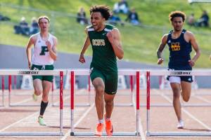 Shorecrest’s Amado Toyo yells as he crosses the finish line to win the 300 Meter Hurdles during Eason Invitational track and field meet on Saturday, April 23, 2022 in Snohomish, Washington. (Olivia Vanni / The Herald)