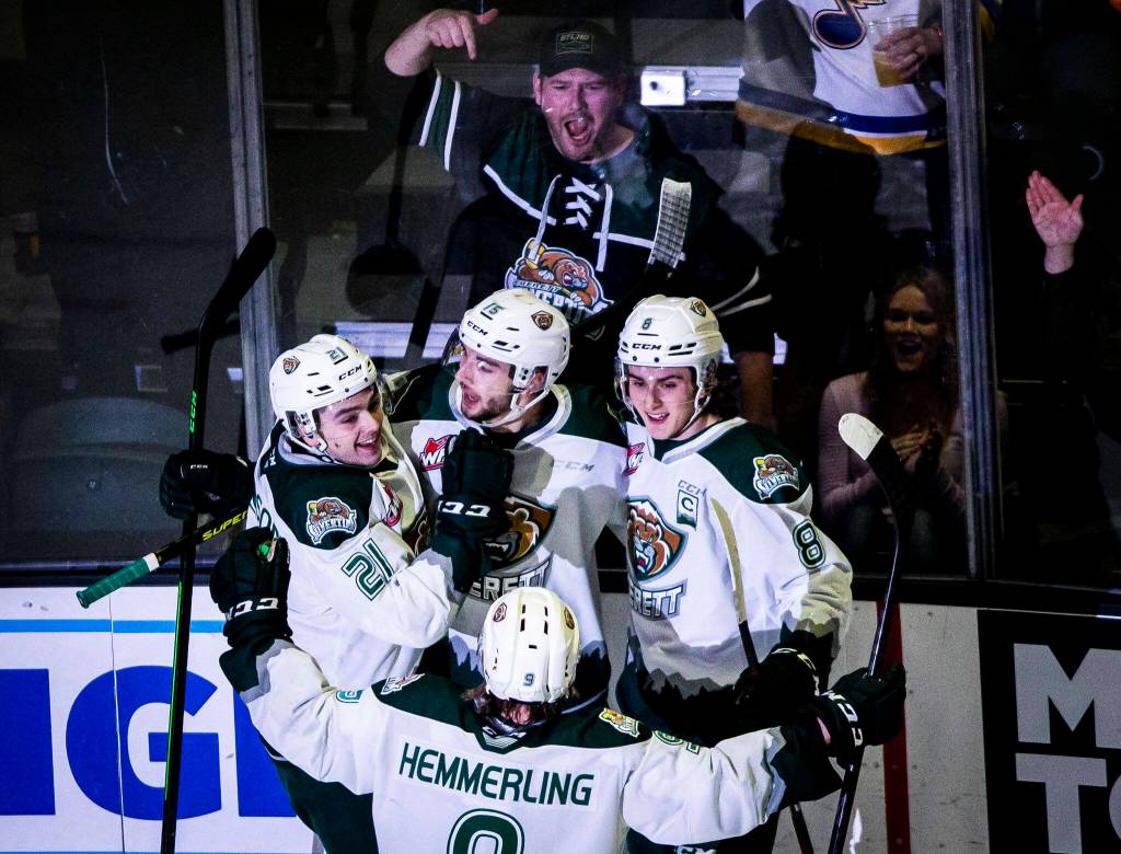 Everett Silvertips players celebrate a goal during the playoff match up against the Vancouver Giants on Saturday, April 23, 2022 in Everett, Washington. (Olivia Vanni / The Herald)