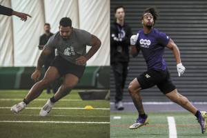 Washington State's Abraham Lucas (left) and Washington's Kyler Gordon (right), both Archbishop Murphy High School alums, work out for scouts at their schools' pro days in March.