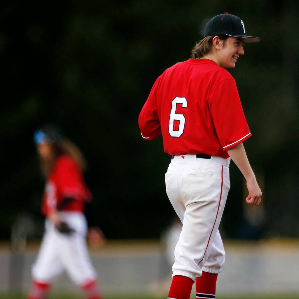Archbishop Murphys Will Jentoft laughs after recording a strikeout against Stanwood Thursday, April 28, 2022, at Archbishop Murphy High School in Everett, Washington. (Ryan Berry / The Herald)