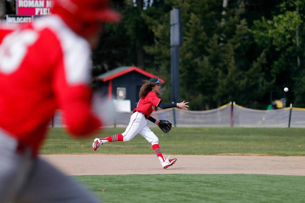 Archbishop Murphys Reese Logsdon tries to turn a double play against Stanwood Thursday, April 28, 2022, at Archbishop Murphy High School in Everett, Washington. (Ryan Berry / The Herald)