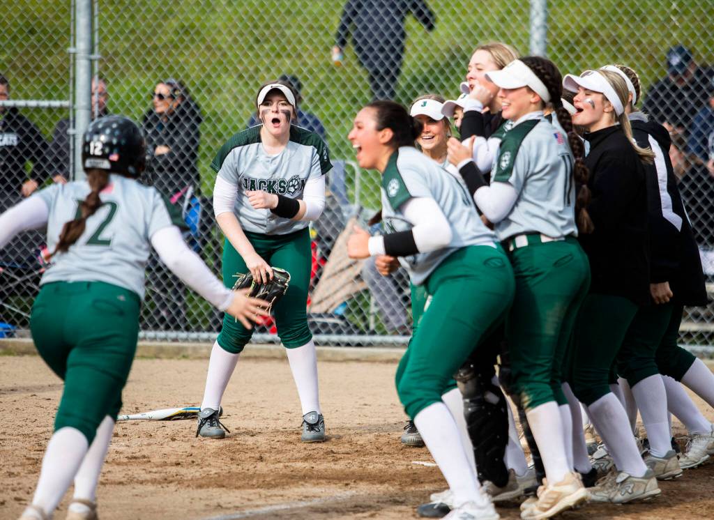Jackson players celebrate senior Kalia Zellmers sixth-inning home run. (Olivia Vanni / The Herald)