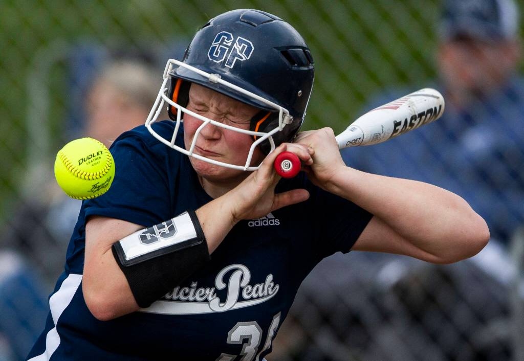 Glacier Peaks Bree Titus grimaces after getting hit by a wild pitch during the game against Jackson on Thursday, April 28, 2022 in Everett, Washington. (Olivia Vanni / The Herald)