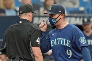 Seattle Mariners manager Scott Servais (9) argues with home plate umpire Shane Livensparger after being ejected from the game during the sixth inning of a baseball game against the Tampa Bay Rays Thursday, April 28, 2022, in St. Petersburg, Fla. (AP Photo/Chris O'Meara)