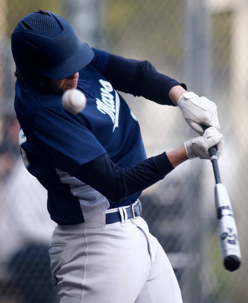 Meadowdales Brandon Brunette fouls off a pitch against Lynnwood Friday, April 29, 2022, at Meadowdale High School in Lynnwood, Washington. (Ryan Berry / The Herald)