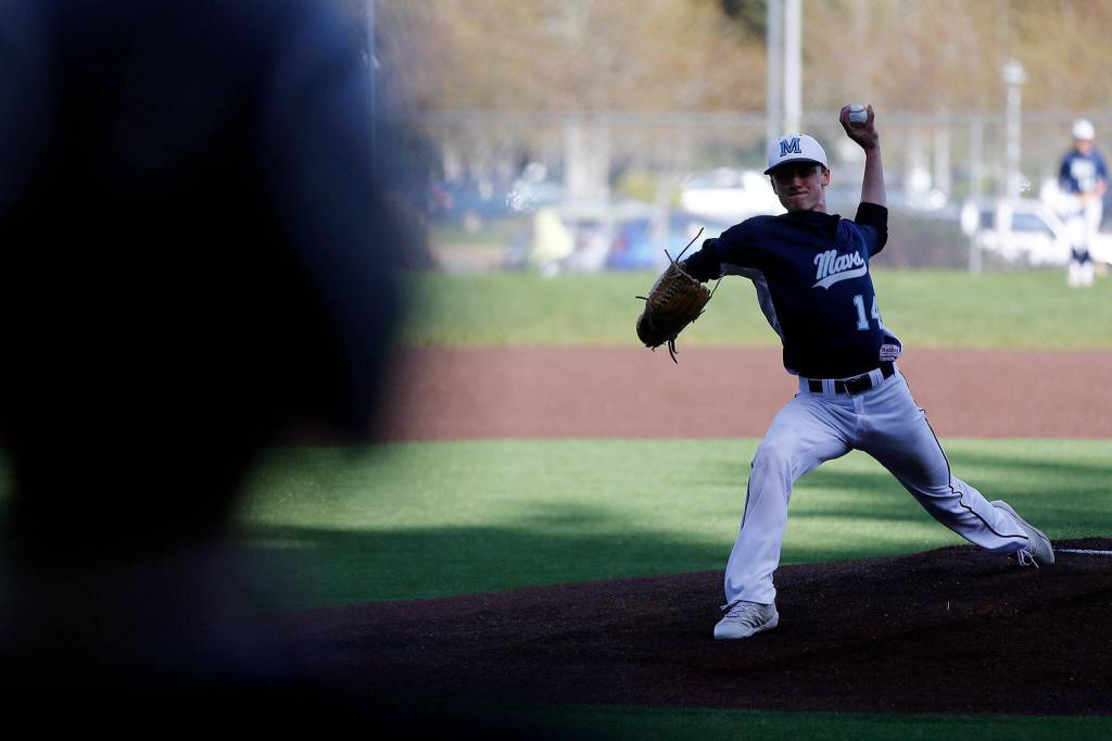 Meadowdales Broderick Bluhm delivers a pitch against Lynnwood Friday, April 29, 2022, at Meadowdale High School in Lynnwood, Washington. (Ryan Berry / The Herald)
