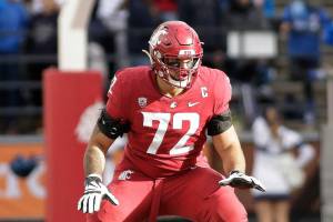 Washington State offensive lineman Abraham Lucas prepares to block during the second half of an NCAA college football game against BYU, Saturday, Oct. 23, 2021, in Pullman, Wash. (AP Photo/Young Kwak)