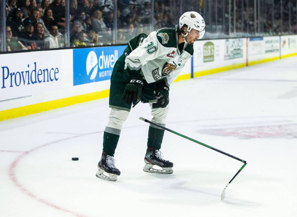 Silvertips Alex Swetlikoff breaks his stick on the ice in frustration at the end of the second period of the game against the Giants on Saturday, April 30, 2022 in Everett, Washington. (Olivia Vanni / The Herald)
