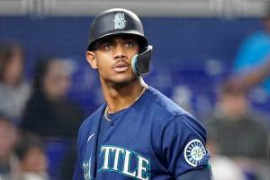 Seattle Mariners' Julio Rodriguez reacts after striking out during the fifth inning of a baseball game against the Miami Marlins, Saturday, April 30, 2022, in Miami. (AP Photo/Wilfredo Lee)