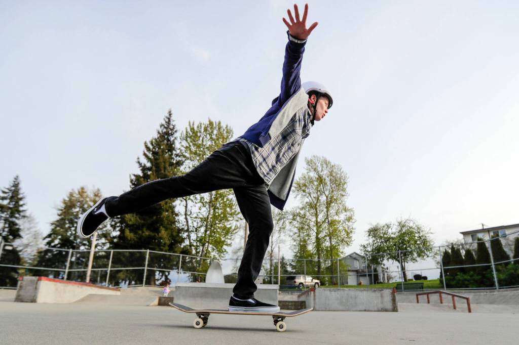 Aly Richards warms up during a skateboard workshop April 28 at Wiggum Hollows Park in Everett. (Kevin Clark / The Herald)