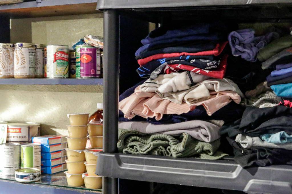 Donations of clothing and food at the Second Chance Foundation in Everett. (Kevin Clark / The Herald)