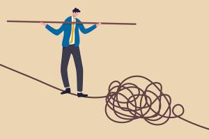 Leadership skill to lead company in crisis situation, manage to solve risky problem concept, confidence businessman leader acrobat walk balance on danger high rope and try to solve tightrope problem.