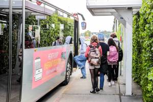 Students load a bus near Sequoia High School in Everett, Washington on May 25, 2022.  (Kevin Clark / The Herald)