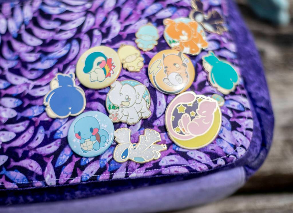 A collection of enamel and button pins available from Adorable Potato Creations. (Olivia Vanni / The Herald)