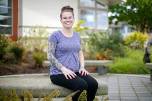 Corporal Brittany Harris, who recruits for the Edmonds Police Department, sits outside the department’s headquarters Wednesday, May 4, 2022, in Edmonds, Washington. Edmonds PD is the most gender diverse department in Snohomish County, as they are the only one that is over one-third female. (Ryan Berry / The Herald)