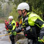 A firefighter anchors the line during a rescue drill in the Skykomish River on Thursday in Index. (Kevin Clark / The Herald)