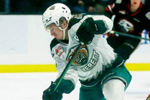 The Everett Silvertips’ Jackson Berezowski scores his first goal of the night against the Portland Winterhawks Saturday, March 26, 2022, at Angel of the Winds Arena in Everett, Washington. (Ryan Berry / The Herald)