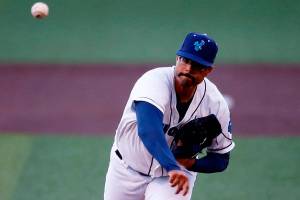AquaSox starting pitcher Isaiah Campbell delivers the first pitch of the season during a game against Eugene Friday, April 8, 2022, at Funko Field in Everett, Washington. (Ryan Berry / The Herald)