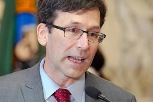 FILE - Washington Attorney General Bob Ferguson speaks March 23, 2022, at the Capitol in Olympia, Wash. Months into a complex trial over their role in flooding Washington with highly addictive painkillers, the nation's three largest opioid distributors have agreed to pay the state $518 million. Ferguson announced the deal Tuesday, May 3, 2022. (AP Photo/Ted S. Warren, File)