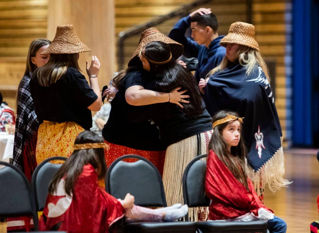 Malory Simpson hugs an individual who shared a personal story of surviving domestic abuse during a MMIW candlelight vigil at the Tulalip Gathering Hall on Thursday in Tulalip. (Olivia Vanni / The Herald)