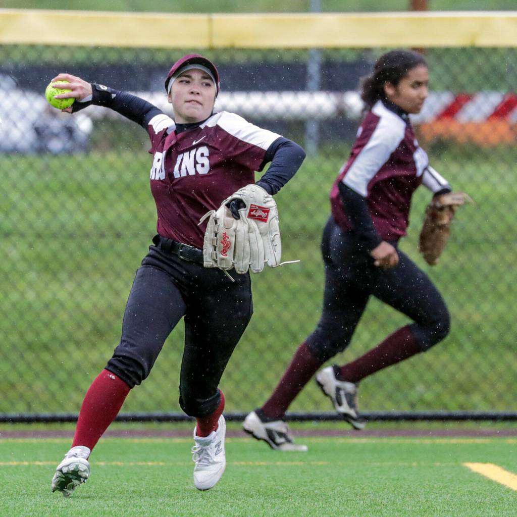 Cascades Sarah Anderson throws after a fly ball against Snohomish High School Thursday afternoon at Phil Johnson Ballfields in Everett, Washington on May 5, 2022. The Panthers won 9-3 in a key matchup between two of the top teams in Wesco 3A/2A. (Kevin Clark / The Herald)