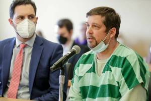 David Nieuwenhuis, left, addresses the court before being sentenced at the Snohomish County Superior Courthouse in Everett, Washington on May 9, 2022. Nieuwenhuis will serve 23 years for the second-degree murder of Candice Black in 2018. (Kevin Clark / The Herald)