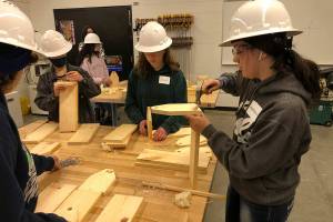 Freshman and sophomore girls from high schools in Snohomish County build wooden tool boxes as an introduction to the Regional Apprenticeship Pathways program at Marysville Pilchuck High School on Thursday, May 5, 2022. (Jon Bauer / The Herald)