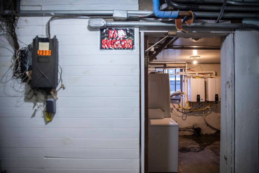 Water heaters that are not up to code are visible from the hallway. (Olivia Vanni / The Herald)