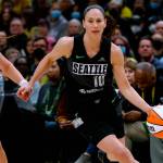 Seattle Storm guard Sue Bird drives around Minnesota Lynx guard Rachel Banham during the first quarter of a WNBA basketball game Friday, May 6, 2022, in Seattle. (Jennifer Buchanan/The Seattle Times via AP)