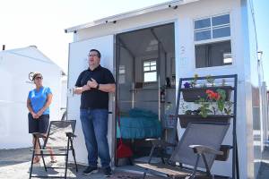 A tiny homes program that opened in early July began with each unit claimed and a wait list of 60. Here Patrick Diller, head of community partnerships for Pallet, discusses the Pallet Shelter Pilot Project on June 29, 2021 in Everett. (Katie Hayes / Herald file)