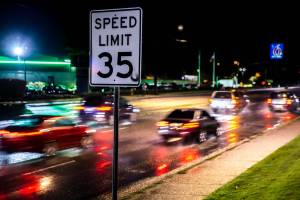 Drivers head northbound on Evergreen Way through the Everett Mall Way intersection past a 35 mph speed limit sign on Wednesday, April 20, 2022 in Everett, Washington. (Olivia Vanni / The Herald)