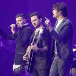 Joel Smallbone (left) and Luke Smallbone (right) of the group For King & Country perform during the Dove Awards in 2018. Theyll appear in concert May 14 at Angel of the Winds Arena in Everett. (Associated Press)