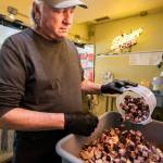 Jeff Knoch, owner of Jeffs Texas Style BBQ in Marysville, prepares a batch of his signature brisket baked beans. (Olivia Vanni / The Herald)