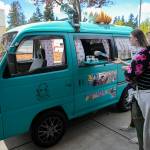 Gabe Fitzpatrick, 11, serves ice cream out of his parents Yay Big Yay High Yay Ice Cream Truck on Saturday, outside Eisenhower Middle School in Everett. (Ryan Berry / The Herald)