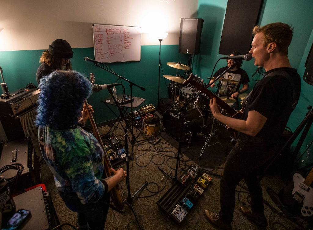 Bad Optics practices in their studio May 17 in Everett. (Olivia Vanni / The Herald)