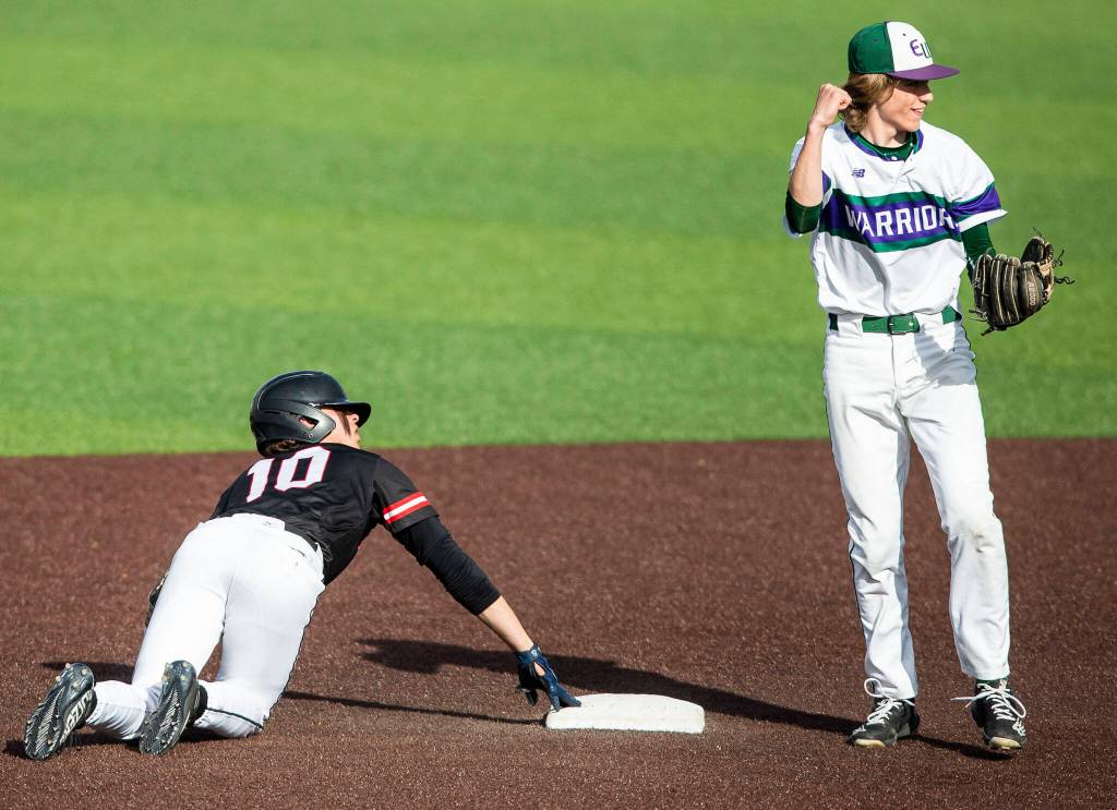 Edmonds-Woodways Grant Oliver reacts to tagging Mountlake Terraces Talan Zenk out after he tries to steal second base during the district semifinal game at Funko Field on Tuesday in Everett. (Olivia Vanni / The Herald)