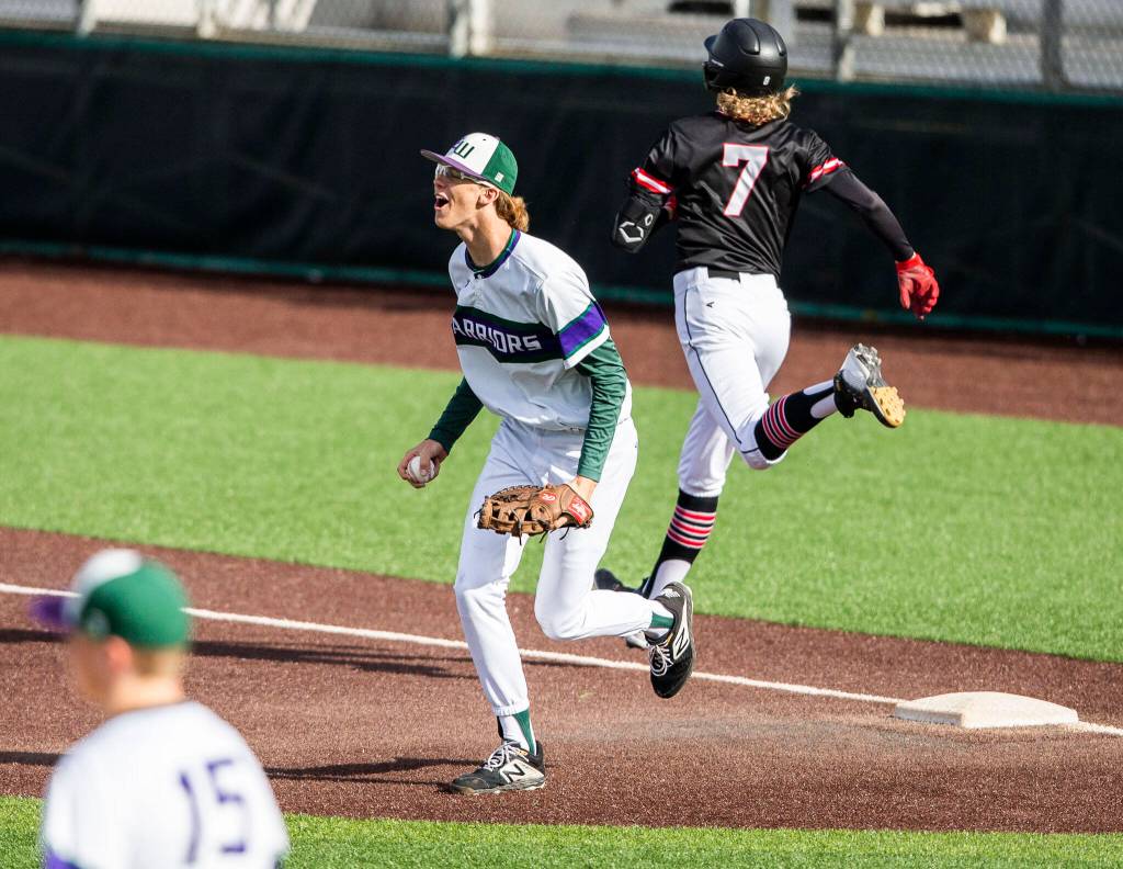 Edmonds-Woodways Gibby Marshall-Inman reacts to a making a double play during the district semifinal game at Funko Field on Tuesday in Everett. (Olivia Vanni / The Herald)