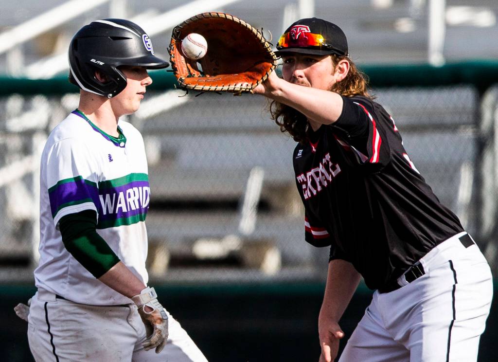 Mountlake Terraces Cody Snow makes a catch at first base during the district semifinal game at Funko Field on Tuesday in Everett. (Olivia Vanni / The Herald)