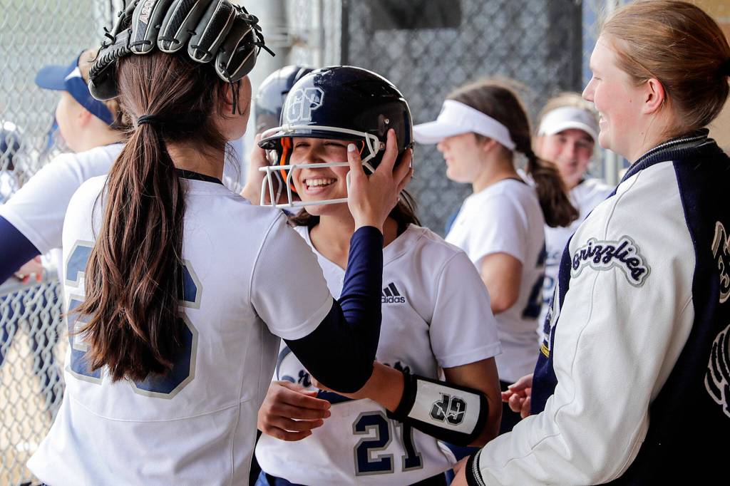 Glacier Peaks Lauren Hufford welcomes Tyler Gordon after her scoring run. (Kevin Clark / The Herald)