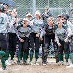 Jackson’s Allie Thomsen is greeted at home for the two run game tying homer against Glacier Peak Wednesday afternoon at Glacier Peak High School in Snohomish, Washington on May 11, 2022.  The Timberwolves defeated the Grizzles 5-3 in extra innings to claim the league title. (Kevin Clark / The Herald)