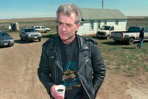 FILE - Randy Weaver, the object of the Ruby Ridge siege, visits with the media at the main FBI roadblock outside the Freemen compound in Montana on April 27, 1996. Weaver, patriarch of a family that were involved in an 11-day Idaho standoff in 1992 with federal agents that left three people dead and served as a spark for the growth of anti-government extremists, has died at the age of 74. His death was announced Thursday, May 12, 2022, in a Facebook post by daughter Sara Weaver, who lives near Kalispell, Montana. (AP Photo/Jim Mone, File)