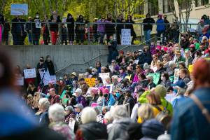 Hundreds gather to listen to a lineup of guest speakers during Snohomish County’s “Bans Off Our Bodies” rally Saturday, May 14, 2022, outside the county courthouse in Everett, Washington. (Ryan Berry / The Herald)