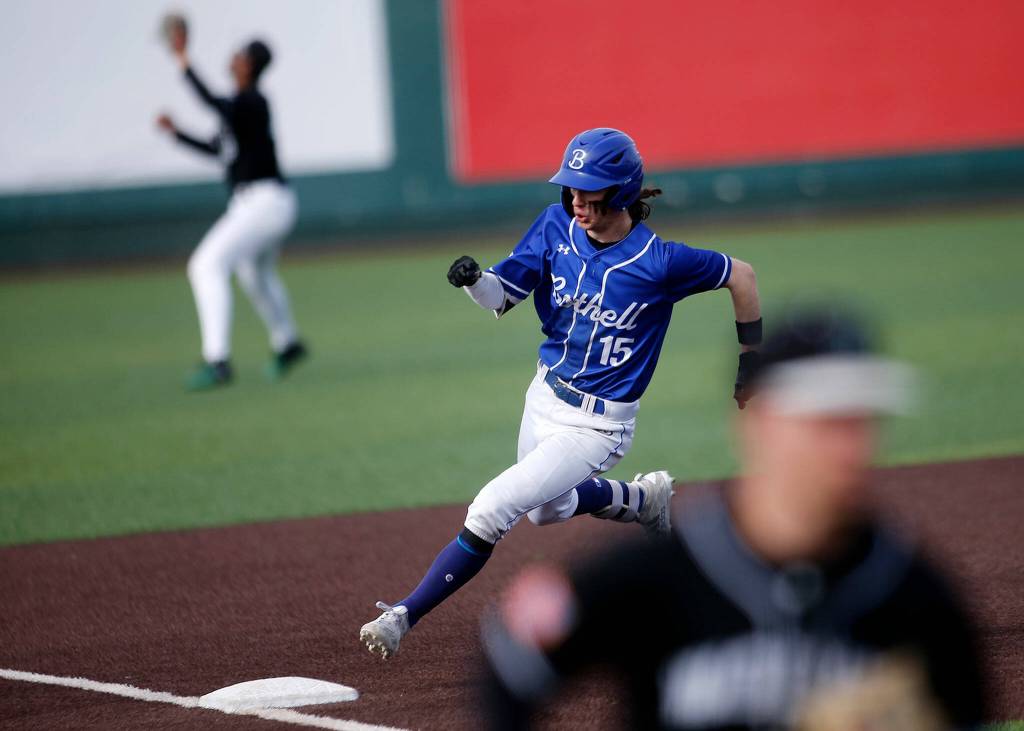 Bothells Charlie Meyer rounds third before scoring on a single and error against Jackson Friday, May 13, 2022, at Funko Field in Everett, Washington. (Ryan Berry / The Herald)