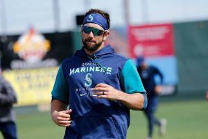 Everett native Steven Souza Jr. jogs with members of the Aquasox while visiting during a team workout Wednesday, April 6, 2022, at Funko Field in Everett, Washington. Souza, who was on his way to Tacoma, took part in batting practice and bought the High A team a couple pizzas. (Ryan Berry / The Herald)