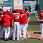 Stanwood players gather at the mound to celebrate their victory over Meadowdale Saturday, May 14, 2022, during a 3A district matchup at Funko Field in Everett, Washington. (Ryan Berry / The Herald)