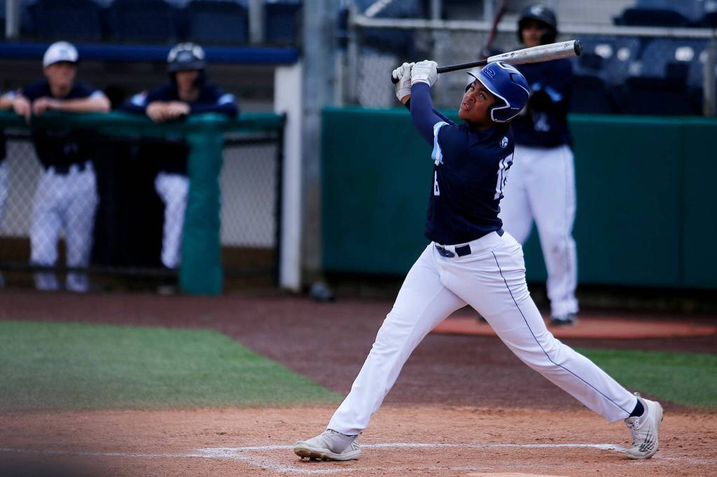 Meadowdales Malikhi Emery-Henderson fouls off a pitch against Stanwood Saturday, May 14, 2022, during a 3A district matchup at Funko Field in Everett, Washington. (Ryan Berry / The Herald)