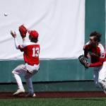Stanwoods Treyton Mascarenas plays the ball off the wall against Meadowdale Saturday, May 14, 2022, during a 3A district matchup at Funko Field in Everett, Washington. (Ryan Berry / The Herald)