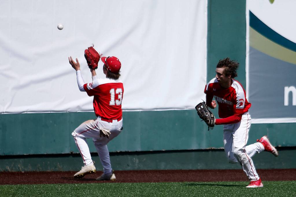 Stanwoods Treyton Mascarenas plays the ball off the wall against Meadowdale Saturday, May 14, 2022, during a 3A district matchup at Funko Field in Everett, Washington. (Ryan Berry / The Herald)