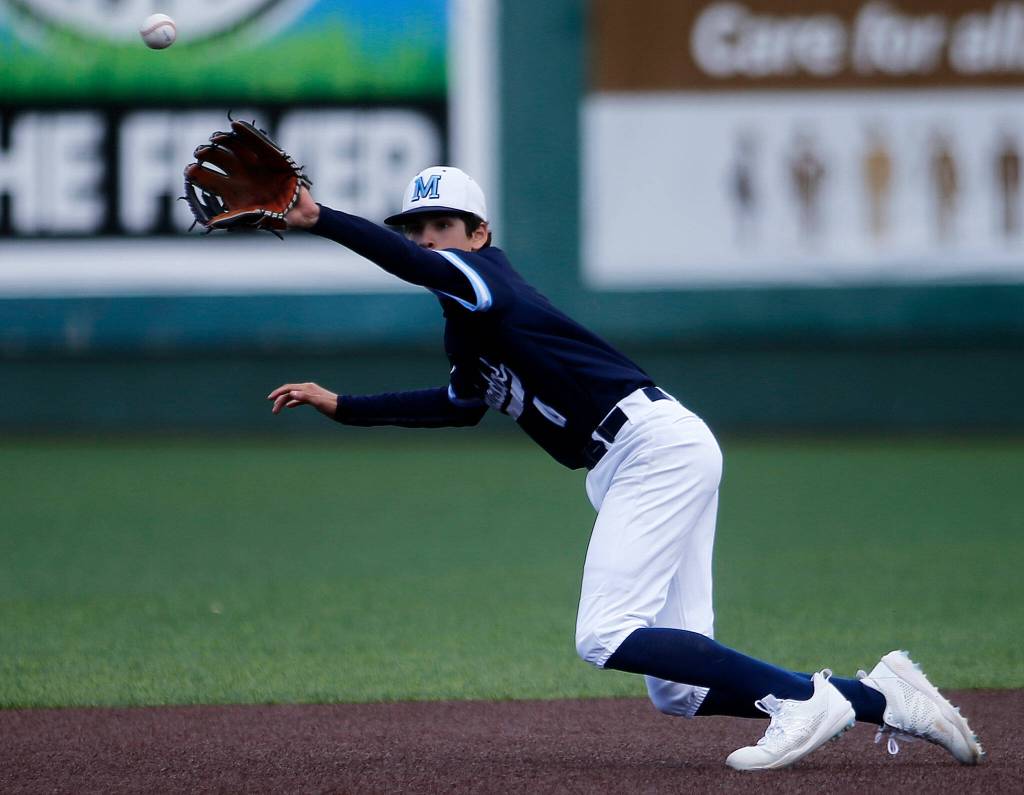 Meadowdales Nicholas Zardis nearly makes a play at shortstop against Stanwood Saturday, May 14, 2022, during a 3A district matchup at Funko Field in Everett, Washington. (Ryan Berry / The Herald)